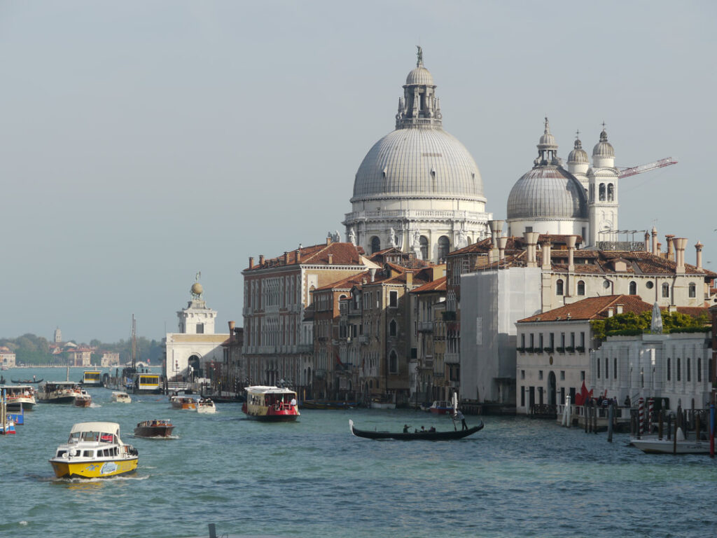 Scenic view of Venice canal with historic buildings and boats.